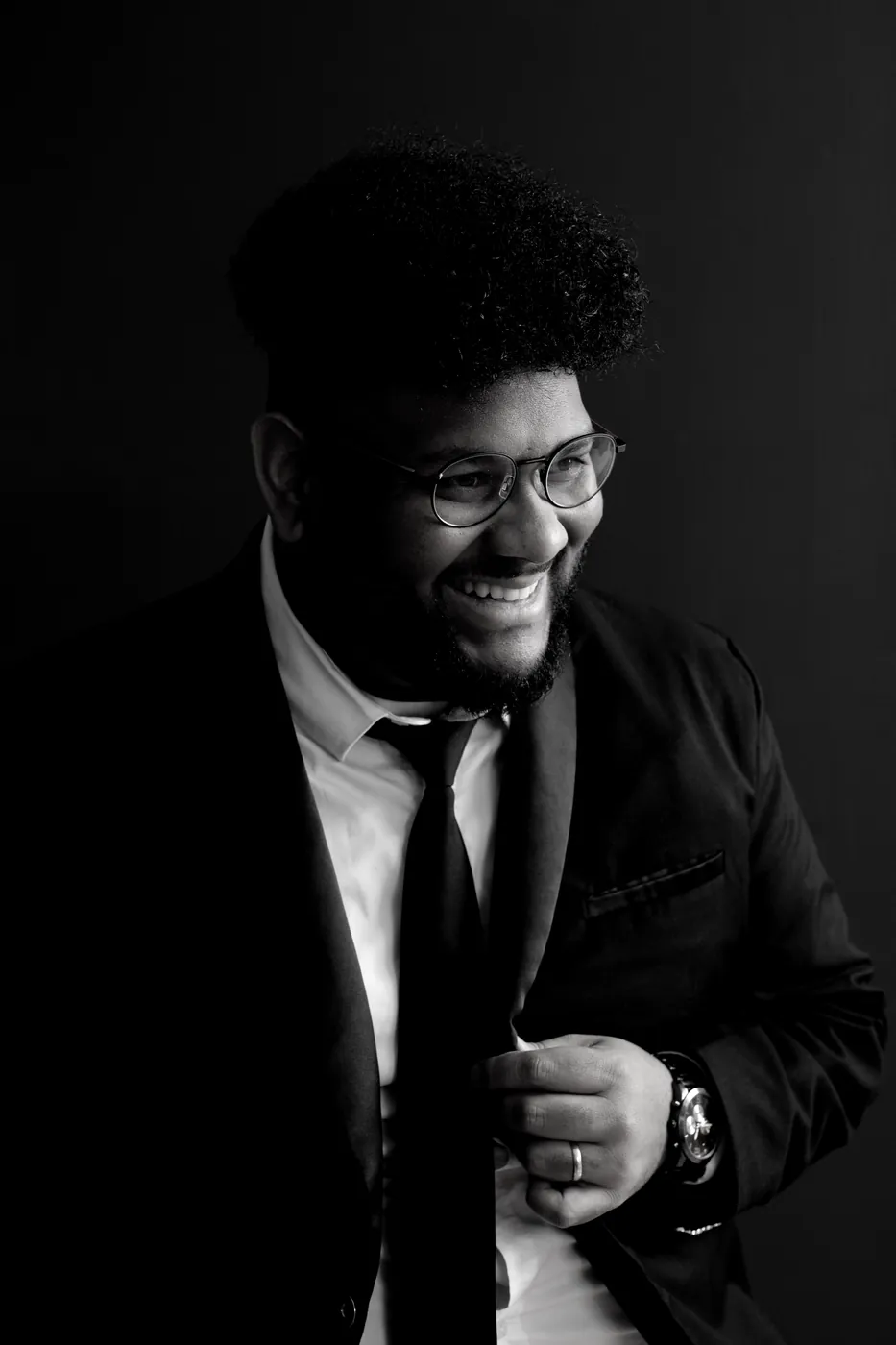 Black and white portrait of Joshua Ali smiling
